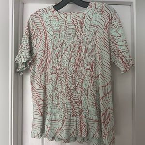 Smocked detail printed tee shirt. New never worn without tags